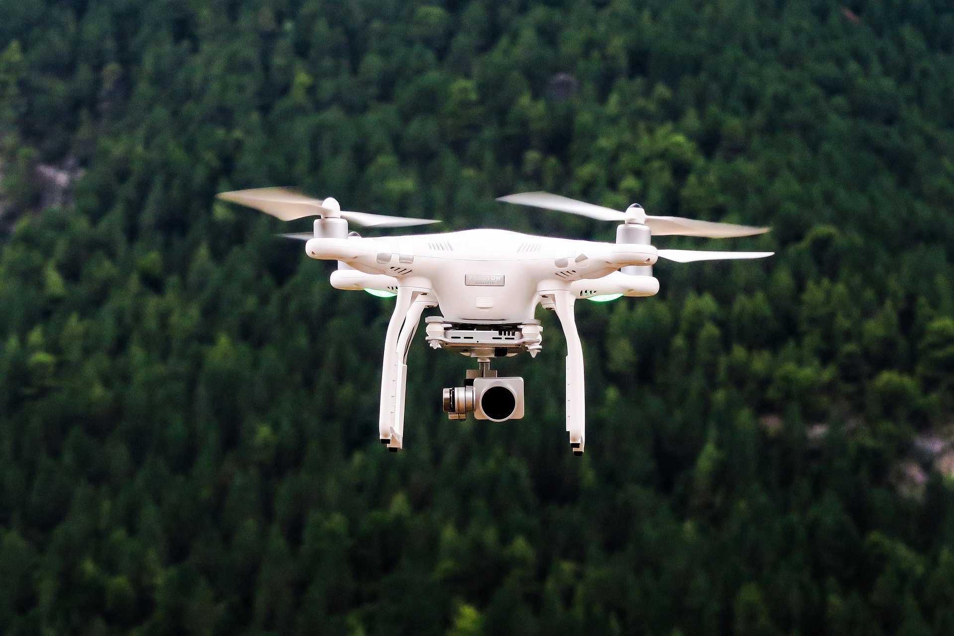 drone flying through a forest