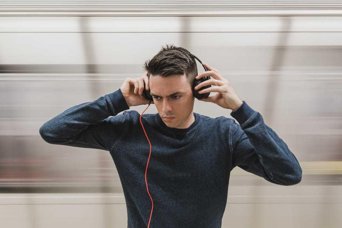 Stylish woman in short blouse, denim jacket with headphones. Front pose  Stock Photo | Adobe Stock