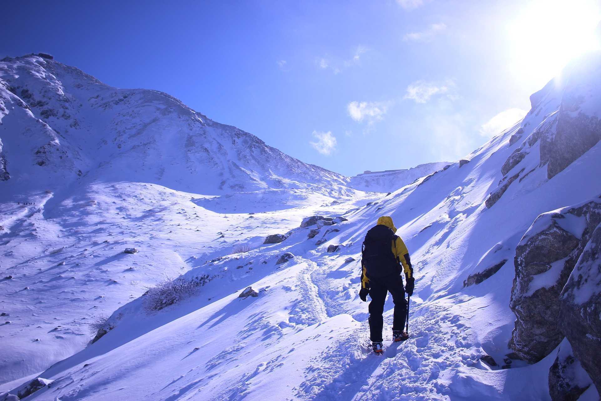 digital nomad climbing a mountain