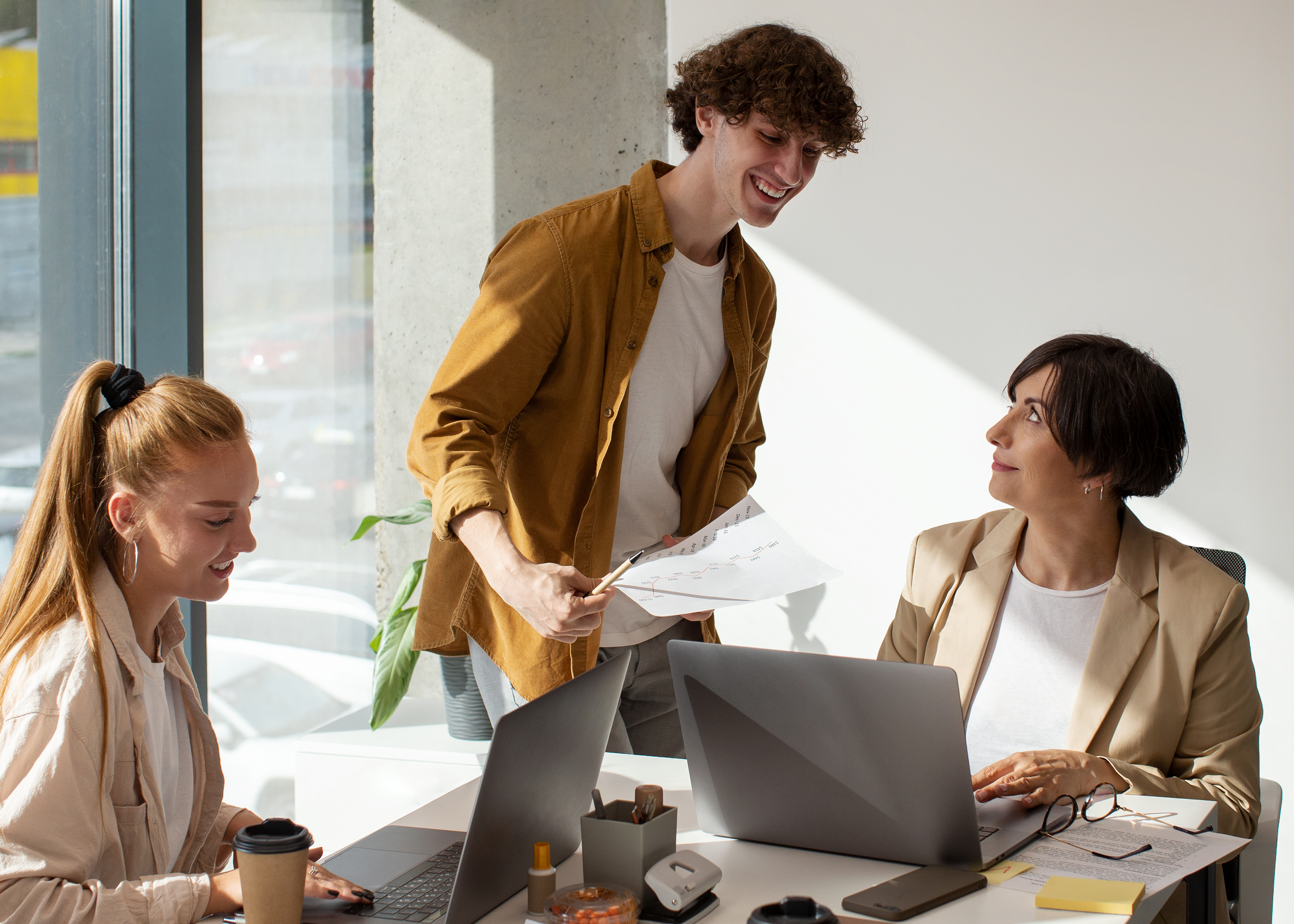 People at work talking to each other, smiling