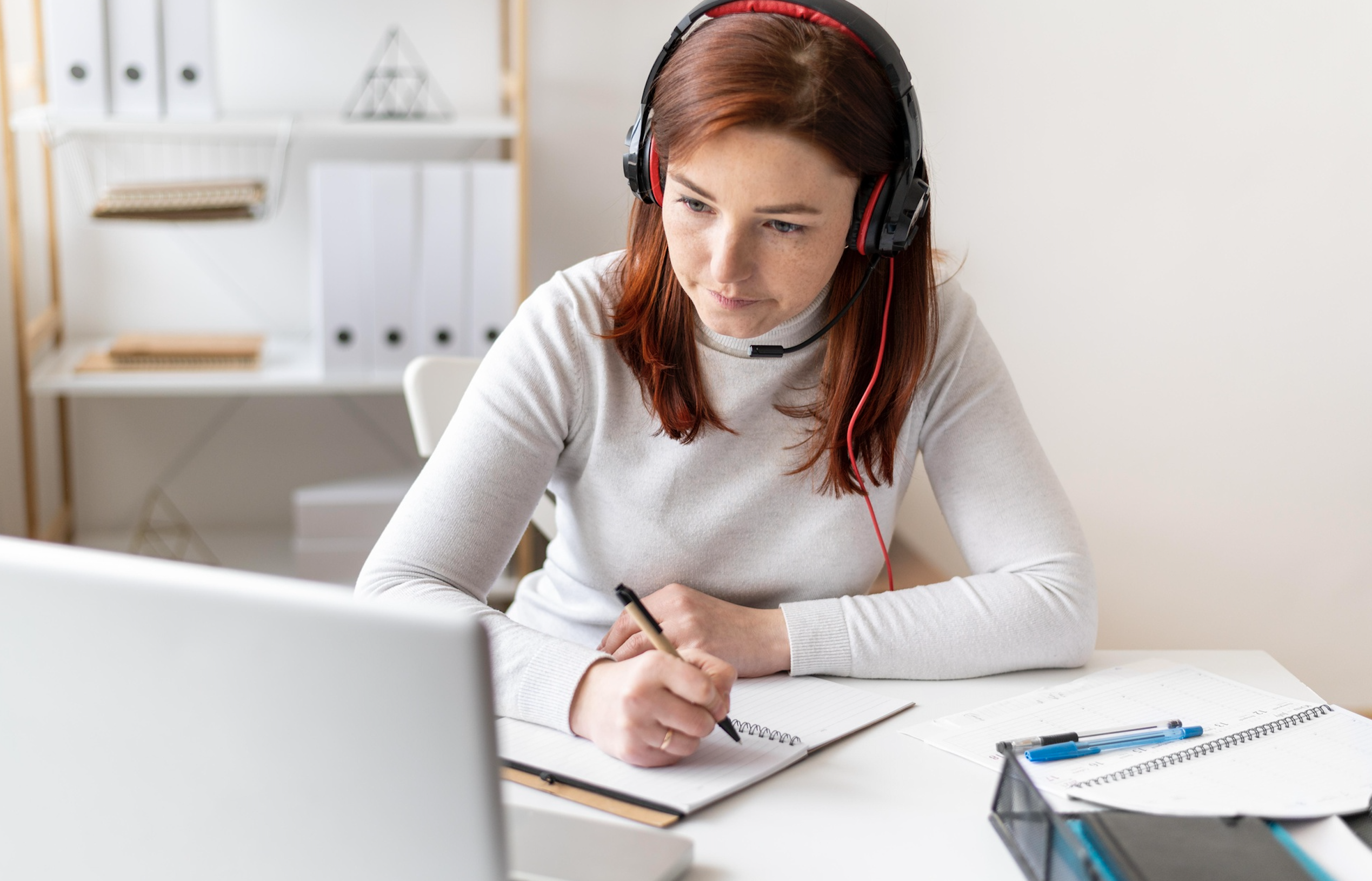 A white female transcriptionist working 