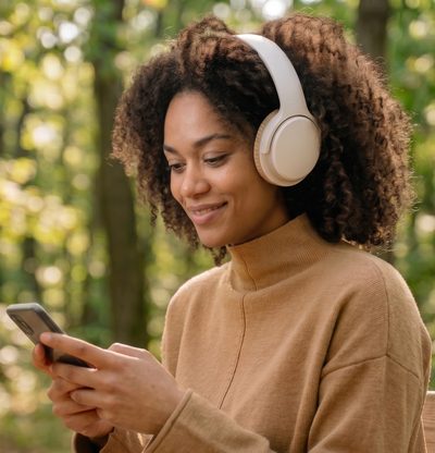 Creator wearing headphones outdoors