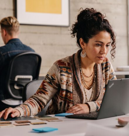 Creator working at a shared desk