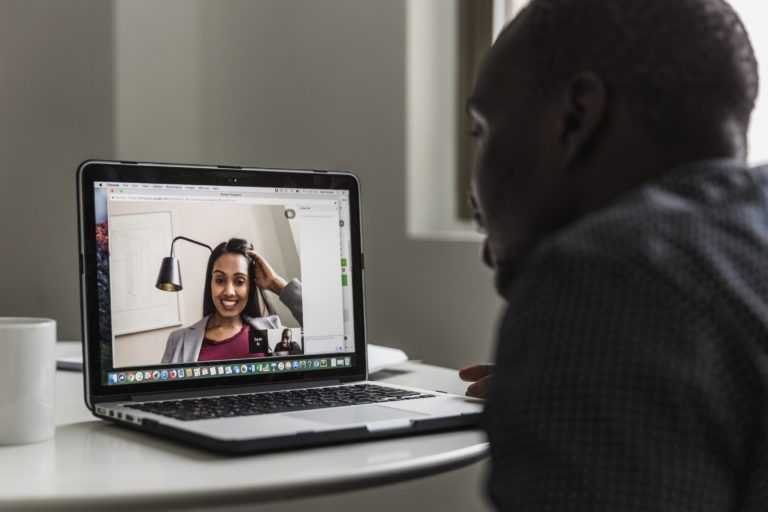 man has a video conference with a woman