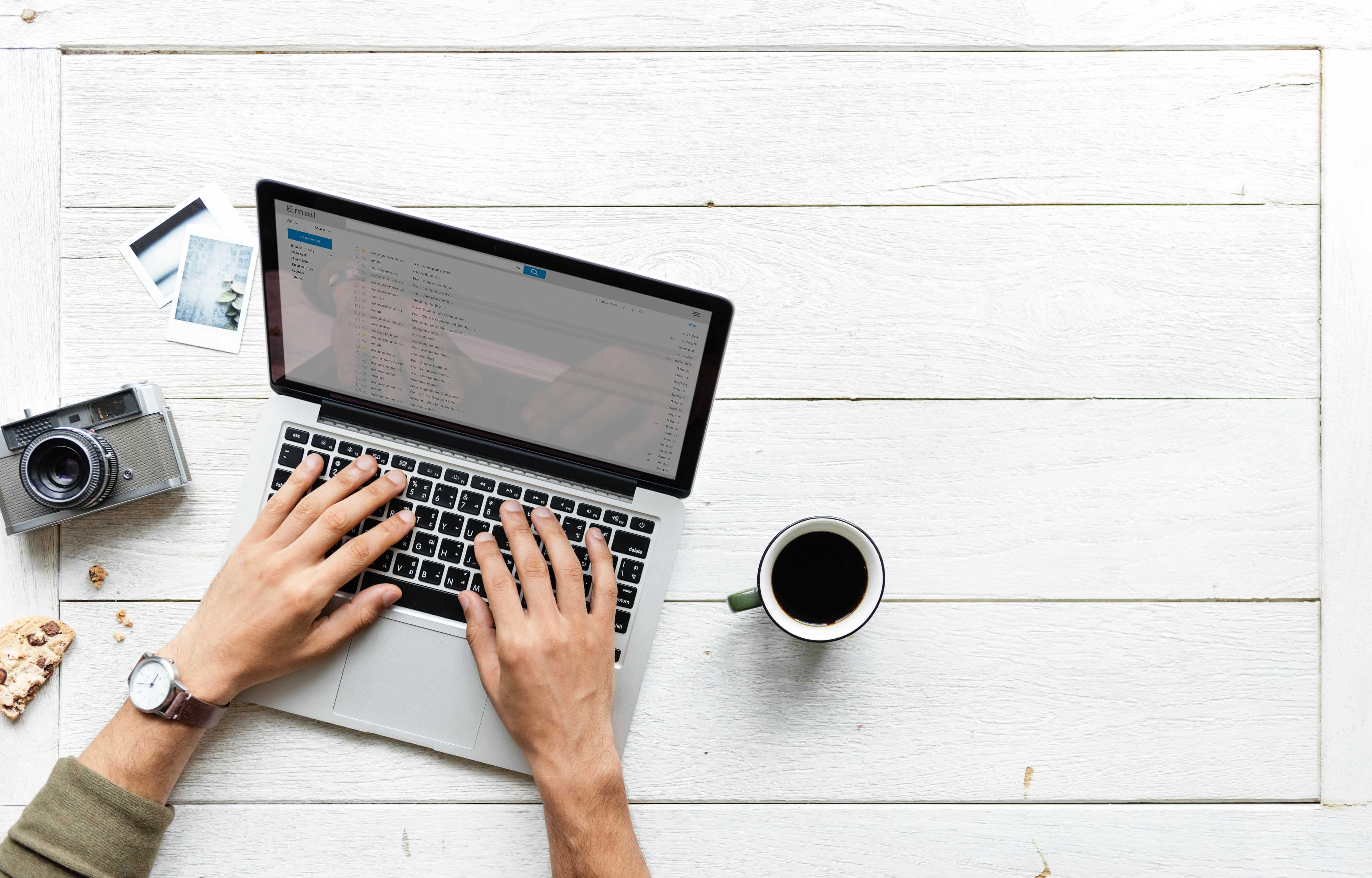 Digital nomad working on a laptop with coffee