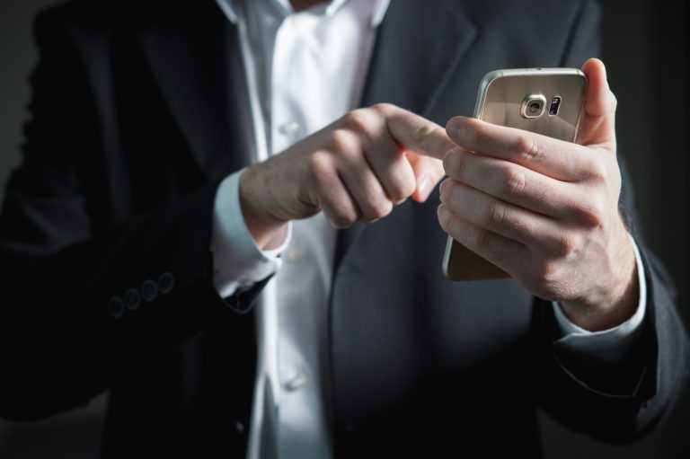 man recording a call on phone