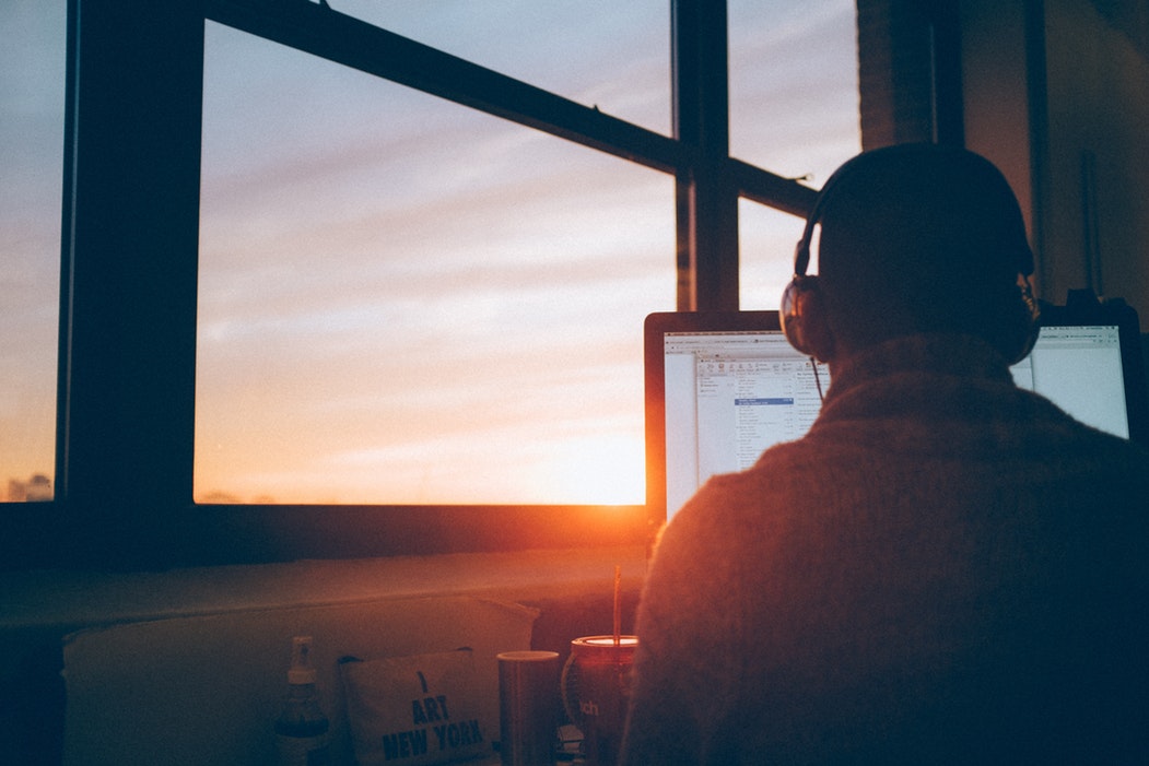 man working in headphones